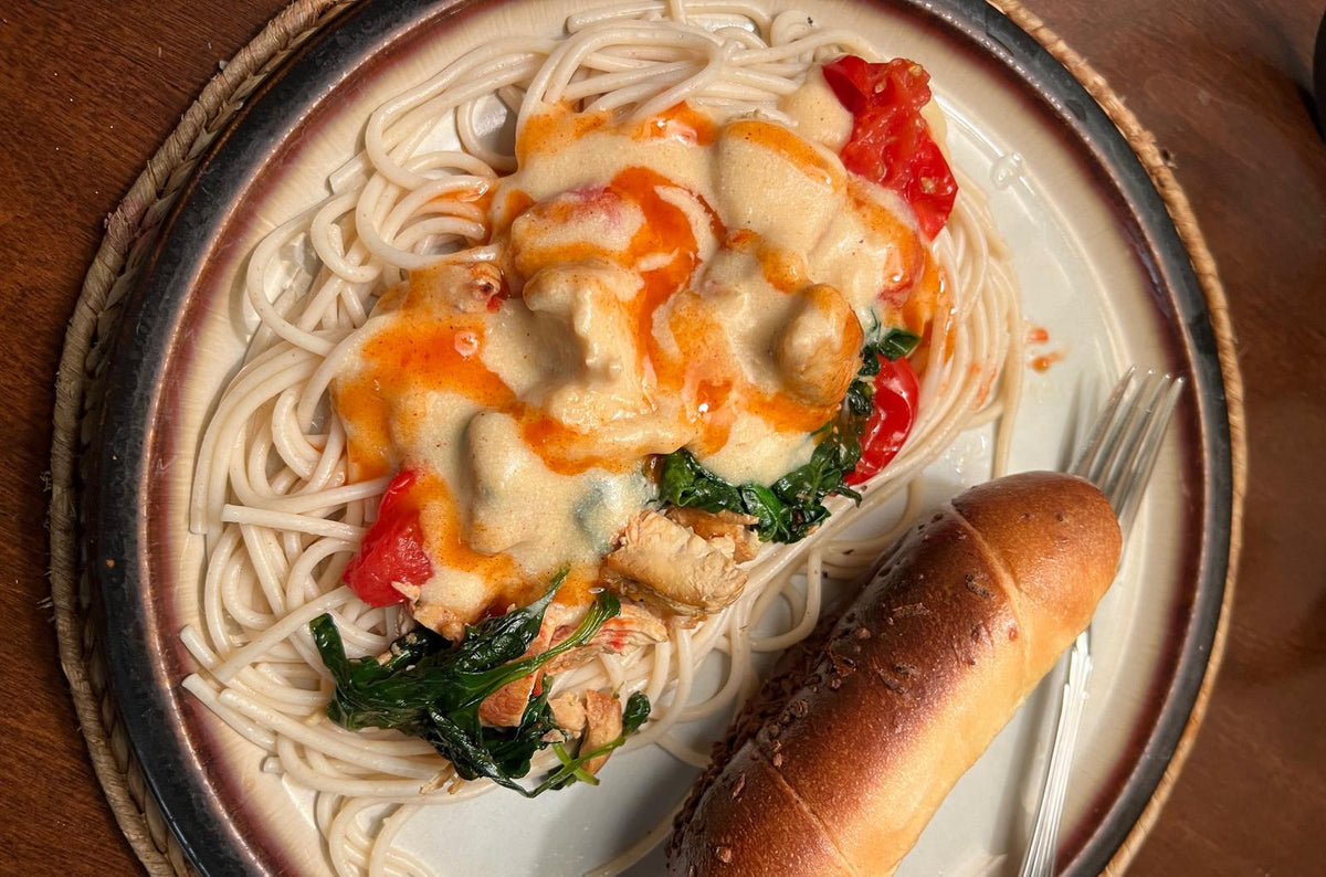 Creamy Chicken Alfredo Primavera topped with Happy Habanero Sauce