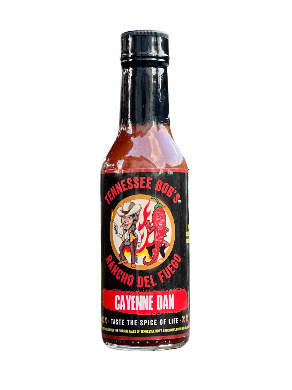 Clear glass bottle of Tennessee Bob's Rancho Del Fuego Cayenne Dan hot sauce with red and black label design.