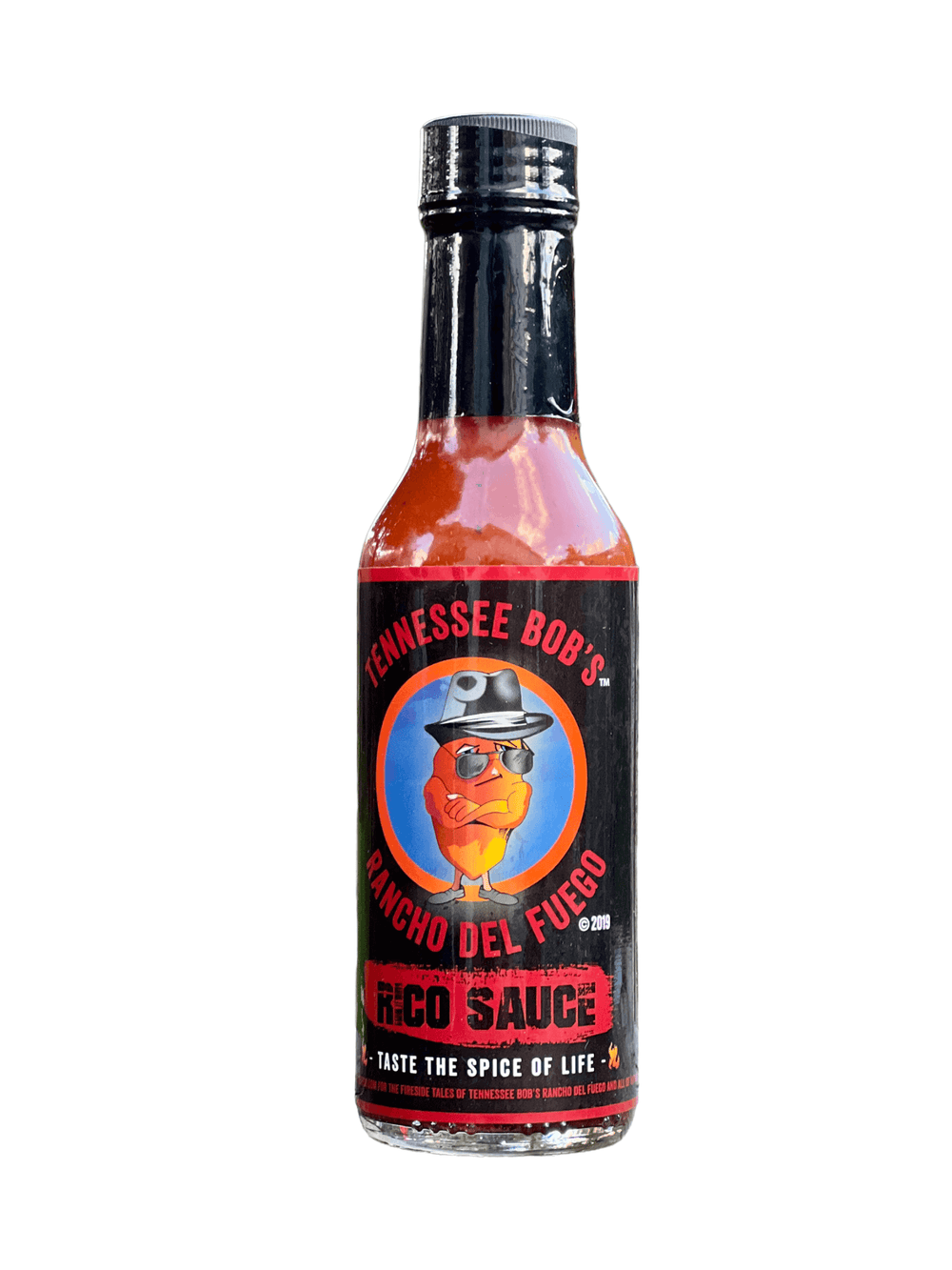 Hot sauce bottle labeled "Tennessee Bob's Rancho Del Fuego Rico Sauce" with a cartoon character on the label.